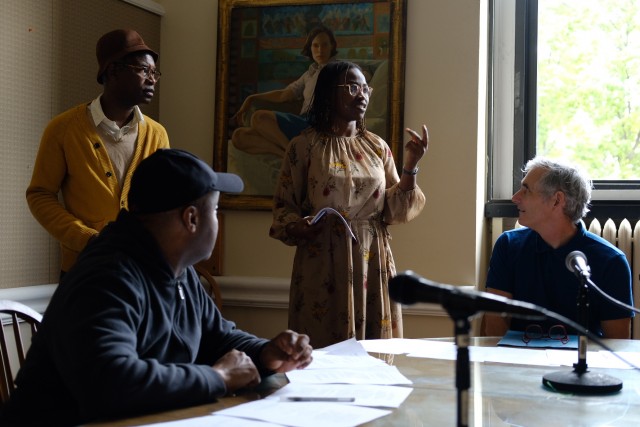 Professor Abosede George, with actors, reads from a Nigerian court case transcript.