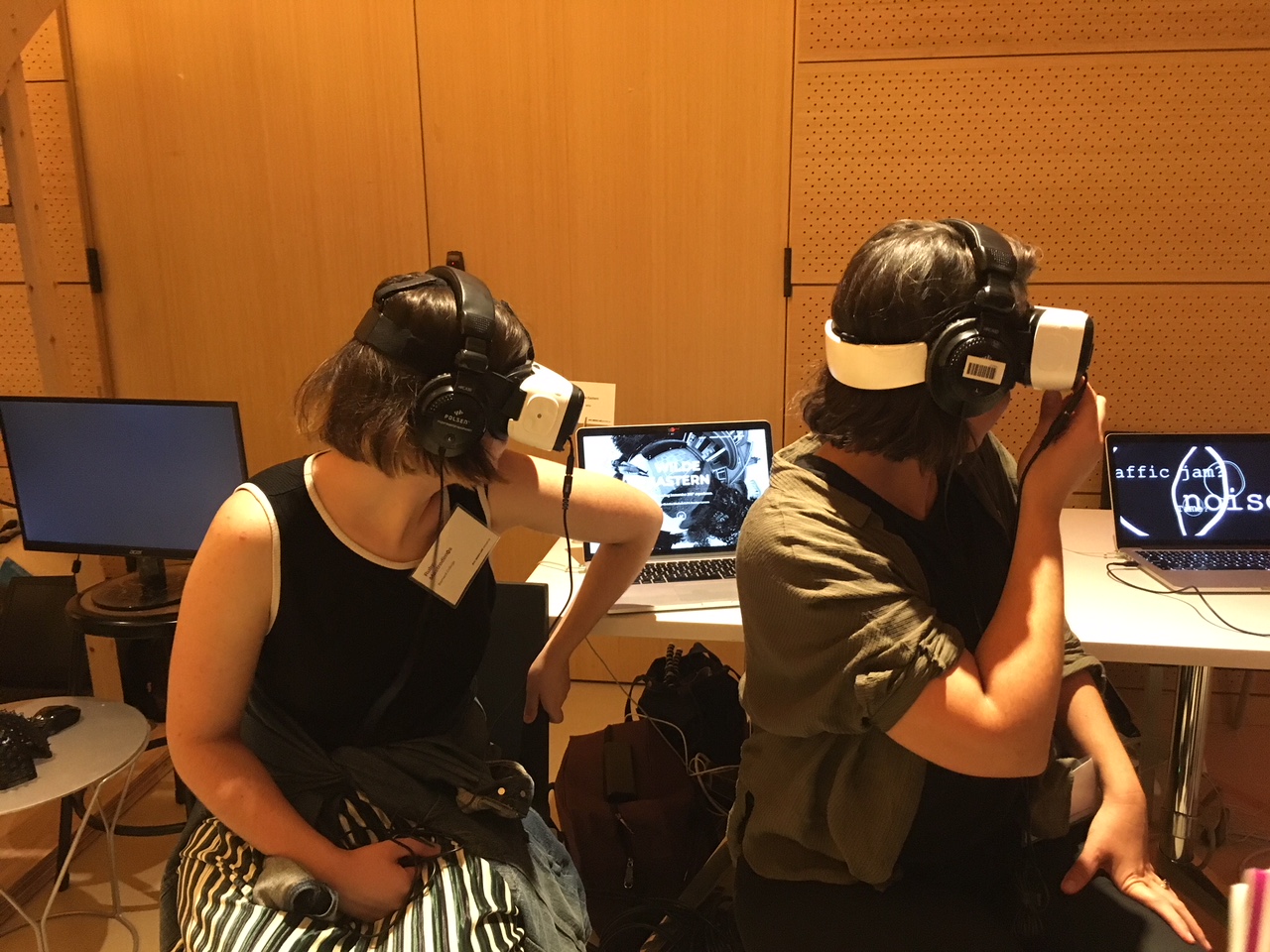 Two women wearing VR headsets