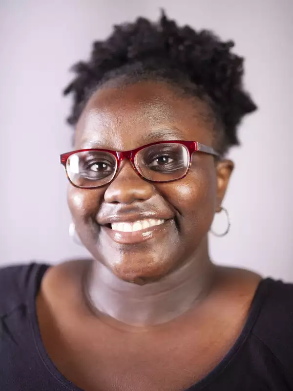 Young African-American Woman w/ Glasses Smiling