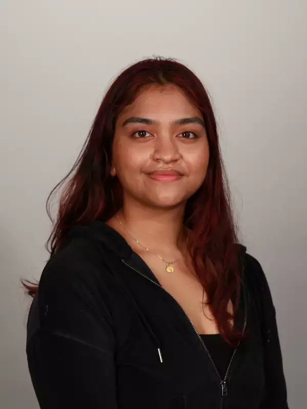 Medium complexion latina woman in her 20s with long straight black hair